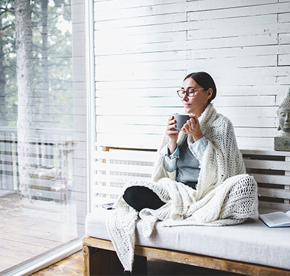 A woman uses mindfulness tips to improve her mindfulness practice each day.