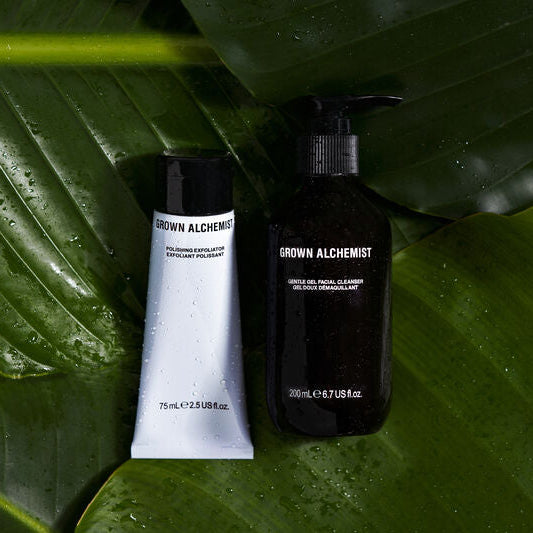 Two Grown Alchemist products on large green leaves