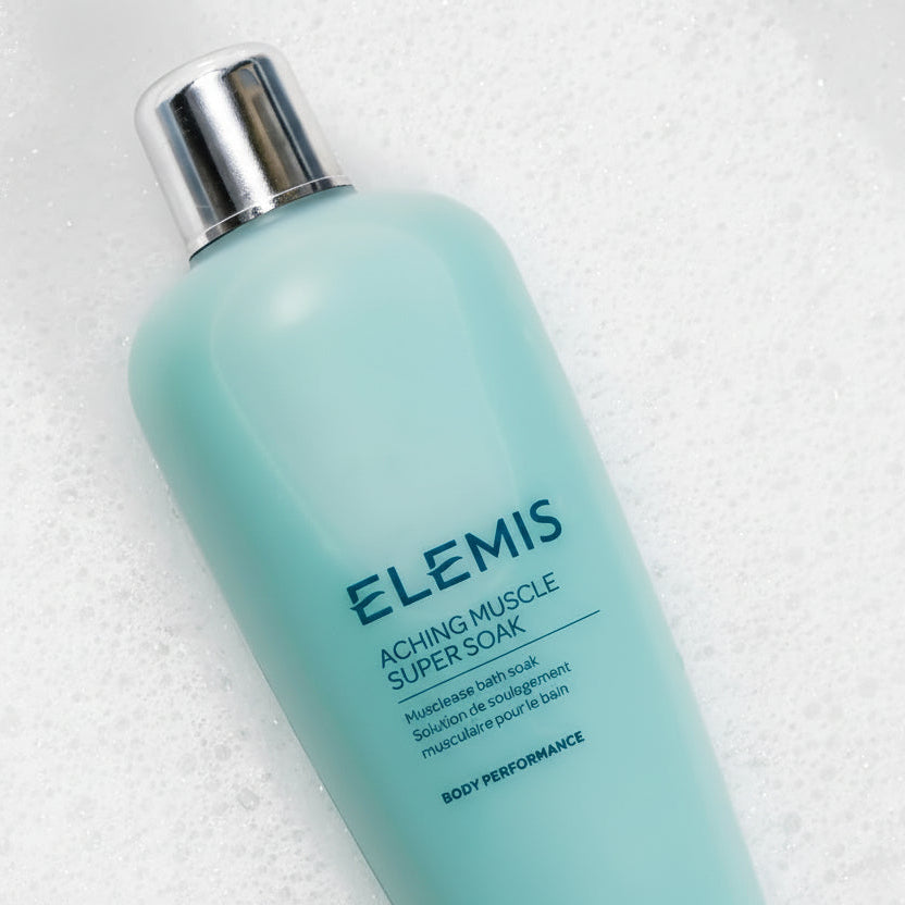 Elemis Aching Muscle Super Soak bottle on a textured white background